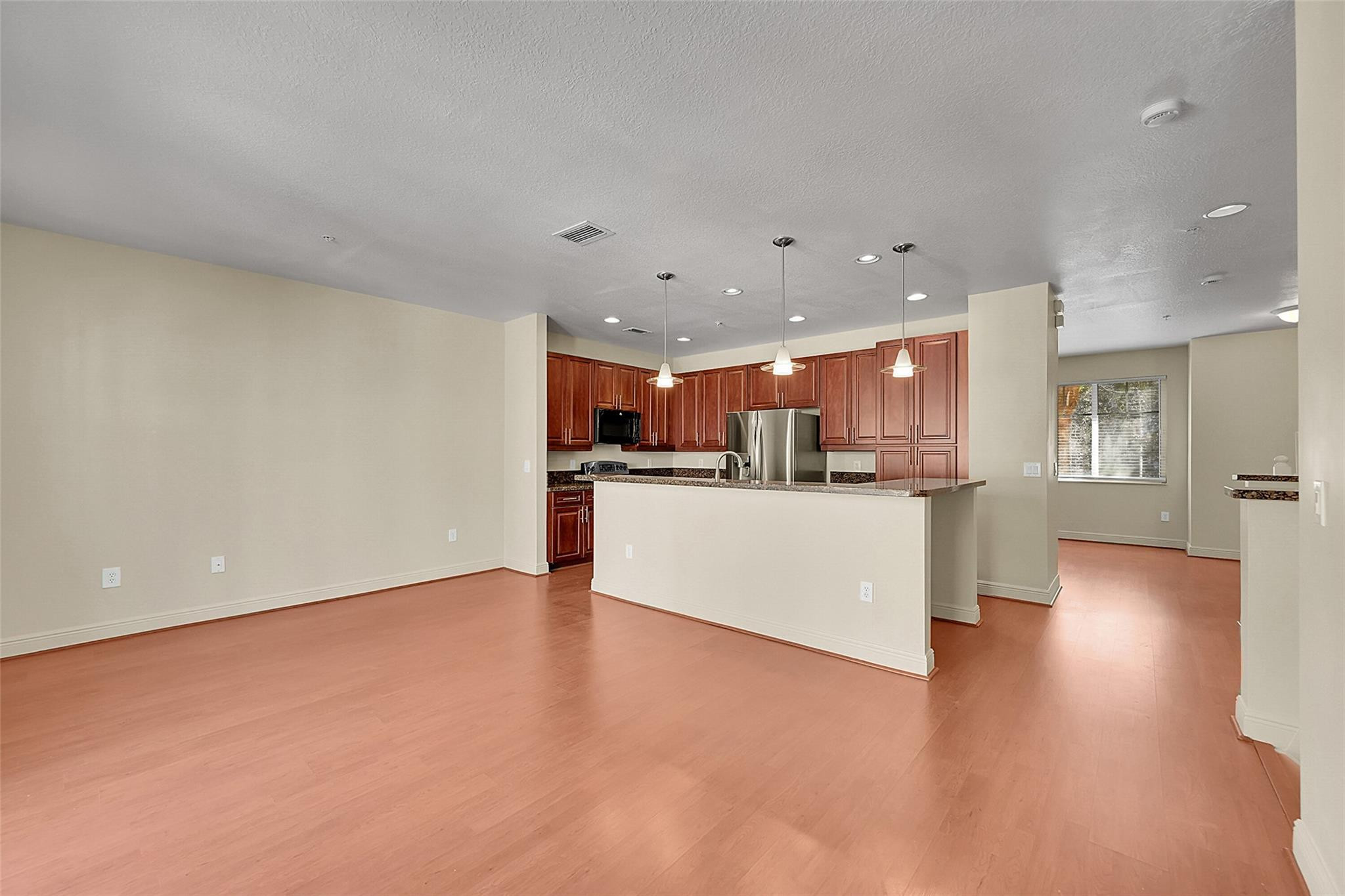 3605 Northwest 5th Terrace Boca Raton, FL 33431 - Photo 9 of 48 a view of kitchen with kitchen island and stainless steel appliances refrigerator