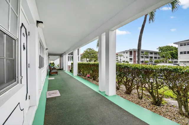 a view of a back yard from a corridor