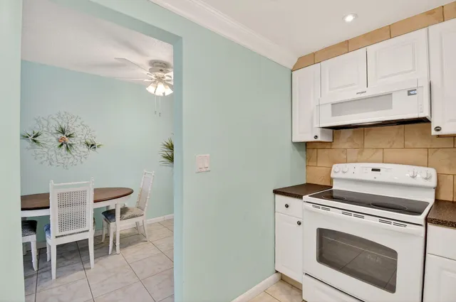 a view of kitchen with cabinets and stainless steel appliances