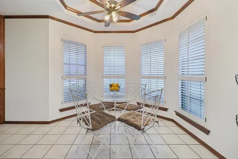 a view of empty room with ceiling fan