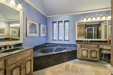 a kitchen with stainless steel appliances a stove sink and cabinets