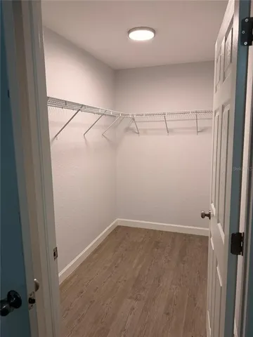 a view of a room with racks on the wall