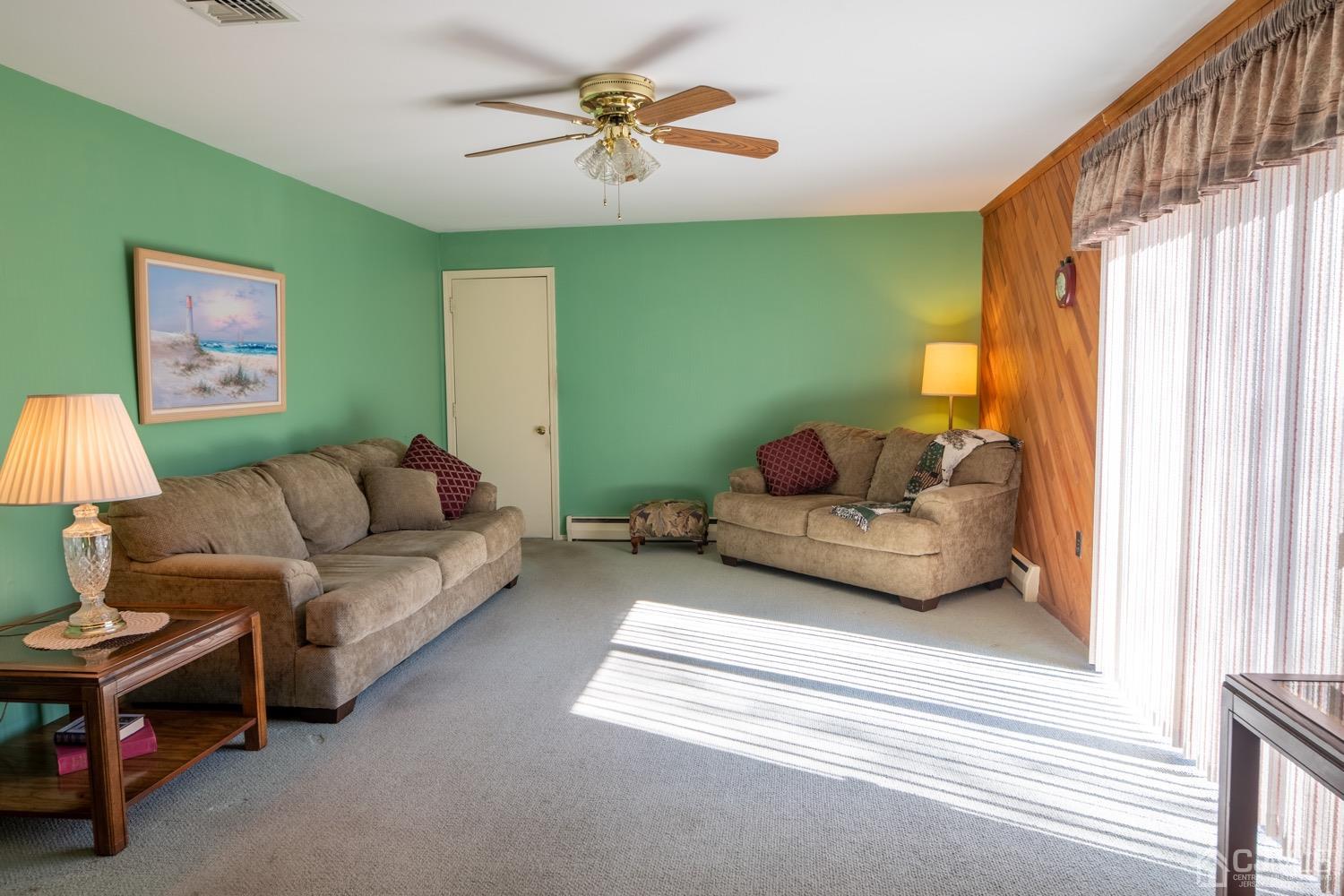 7 Sims Road Edison, NJ 08817 - Photo 21 of 54 a living room with furniture a couch and a window