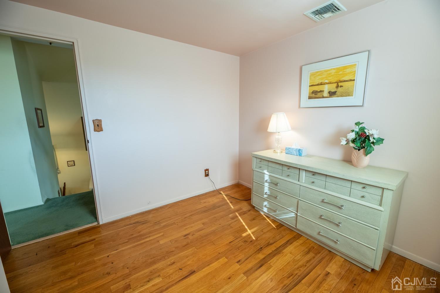 7 Sims Road Edison, NJ 08817 - Photo 41 of 54 a bed room with a bed and a dresser