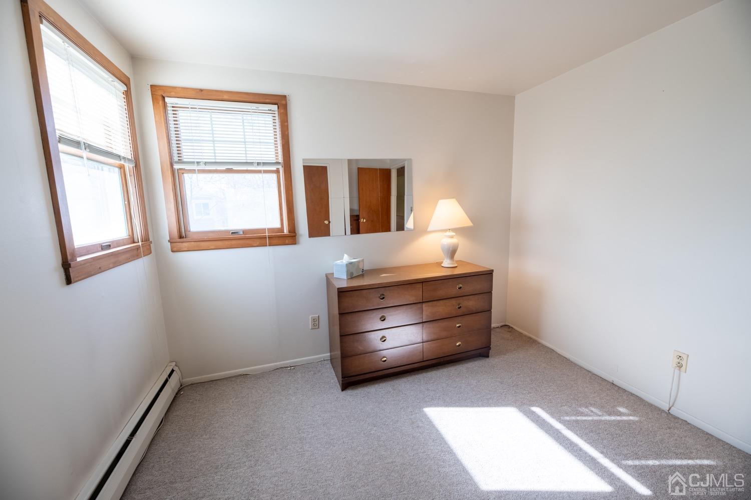 7 Sims Road Edison, NJ 08817 - Photo 44 of 54 a room with a dresser and a window