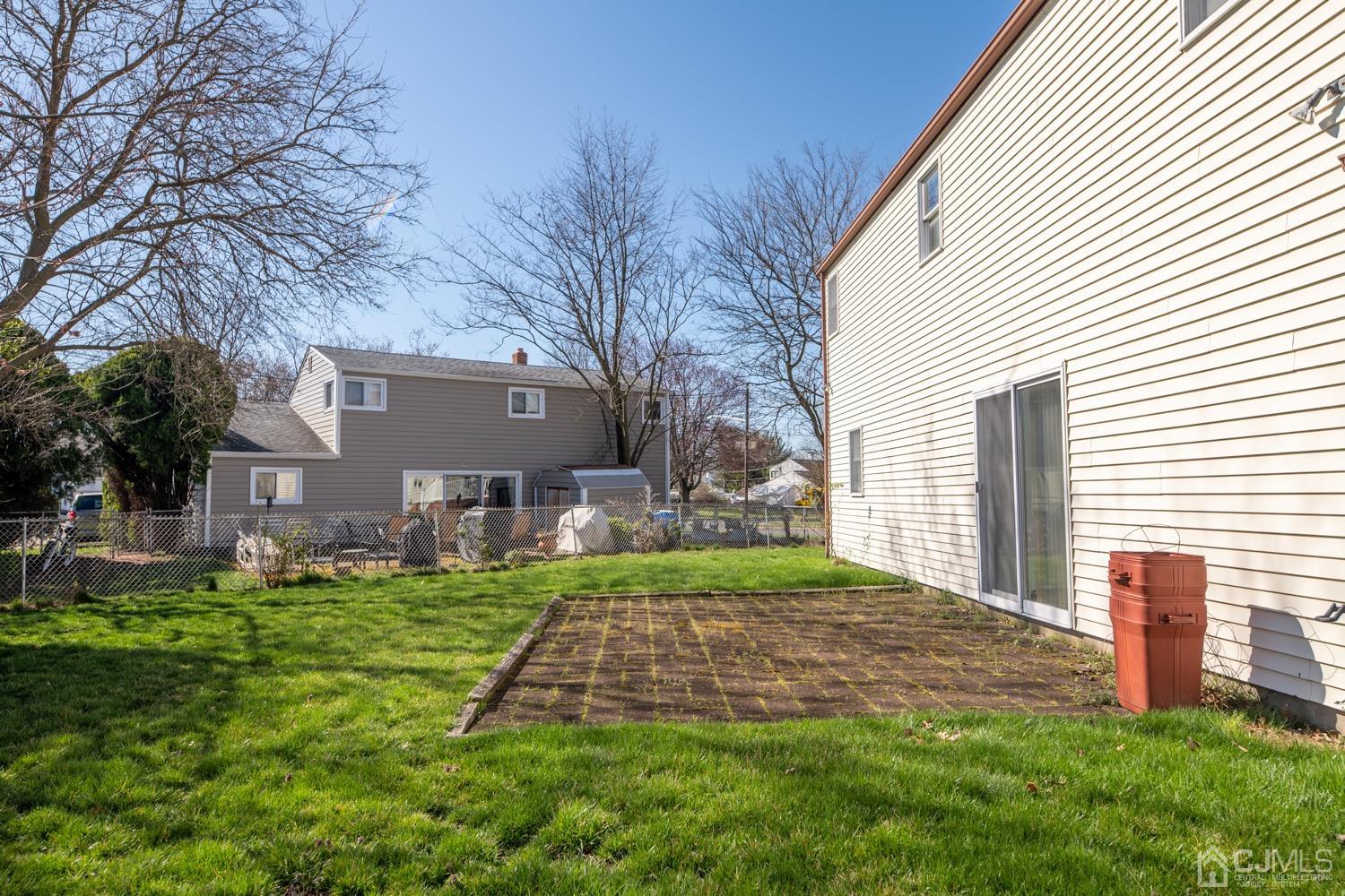 7 Sims Road Edison, NJ 08817 - Photo 51 of 54 a front view of a house with a yard and garage
