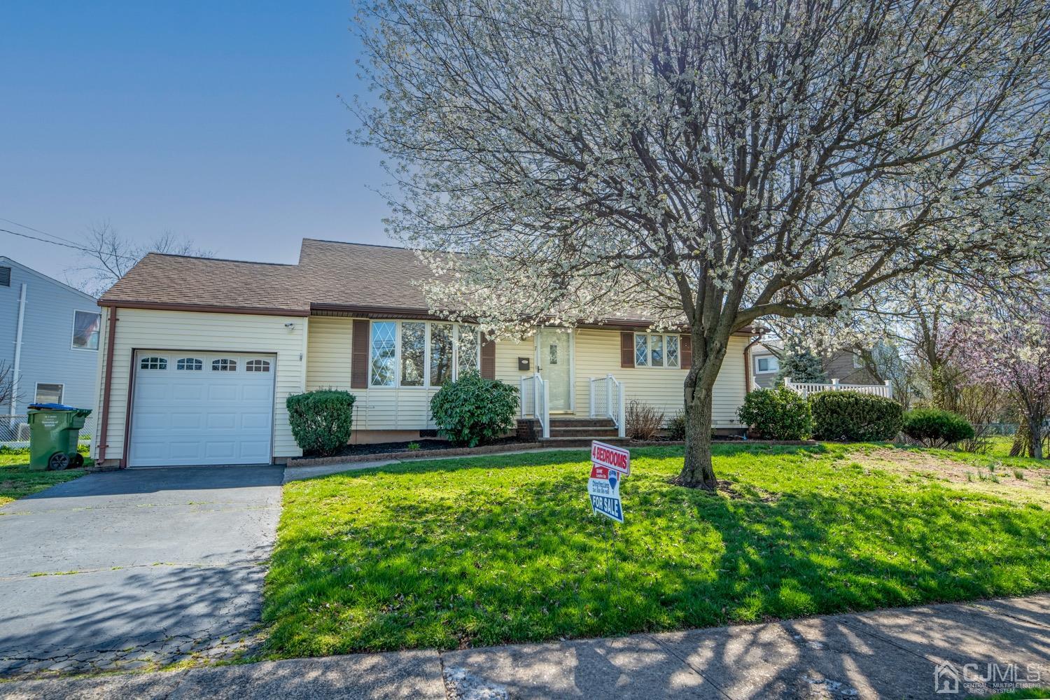 7 Sims Road Edison, NJ 08817 - Photo 6 of 54 a front view of house with yard and green space