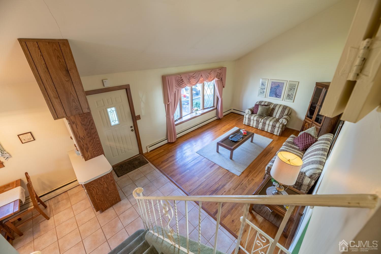 7 Sims Road Edison, NJ 08817 - Photo 7 of 54 a living room with furniture and a flat screen tv