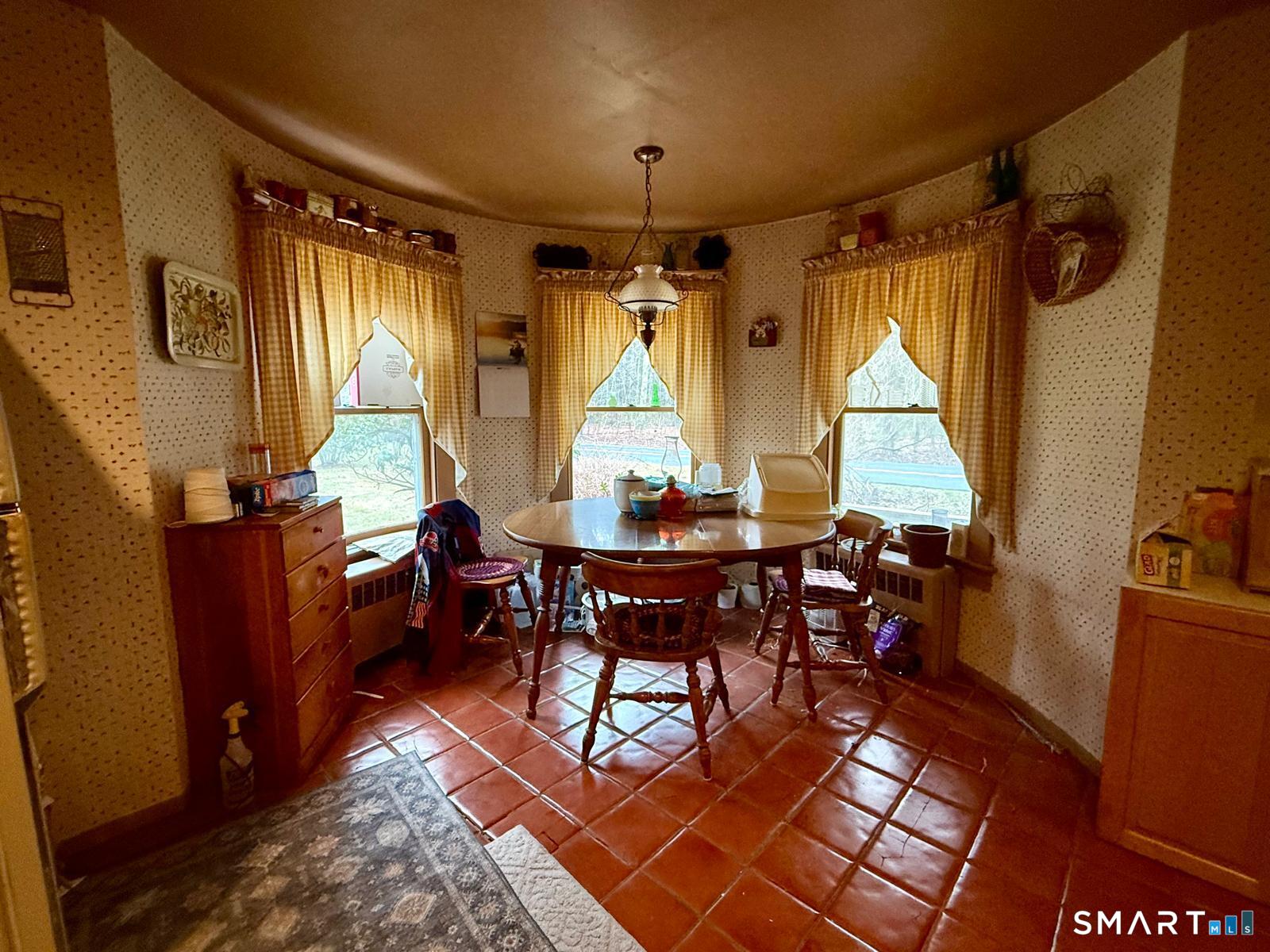 21 High Bridge Road Newtown, CT 06482 - Photo 5 of 10 a view of a dining room with furniture window and wooden floor