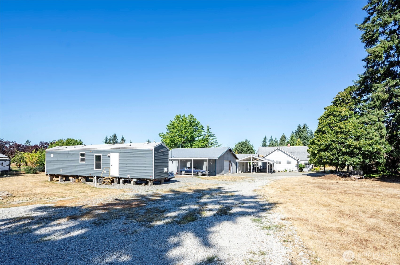 4712 Brookdale Road East Tacoma, WA 98446 - Photo 11 of 40 a view of a house with a yard