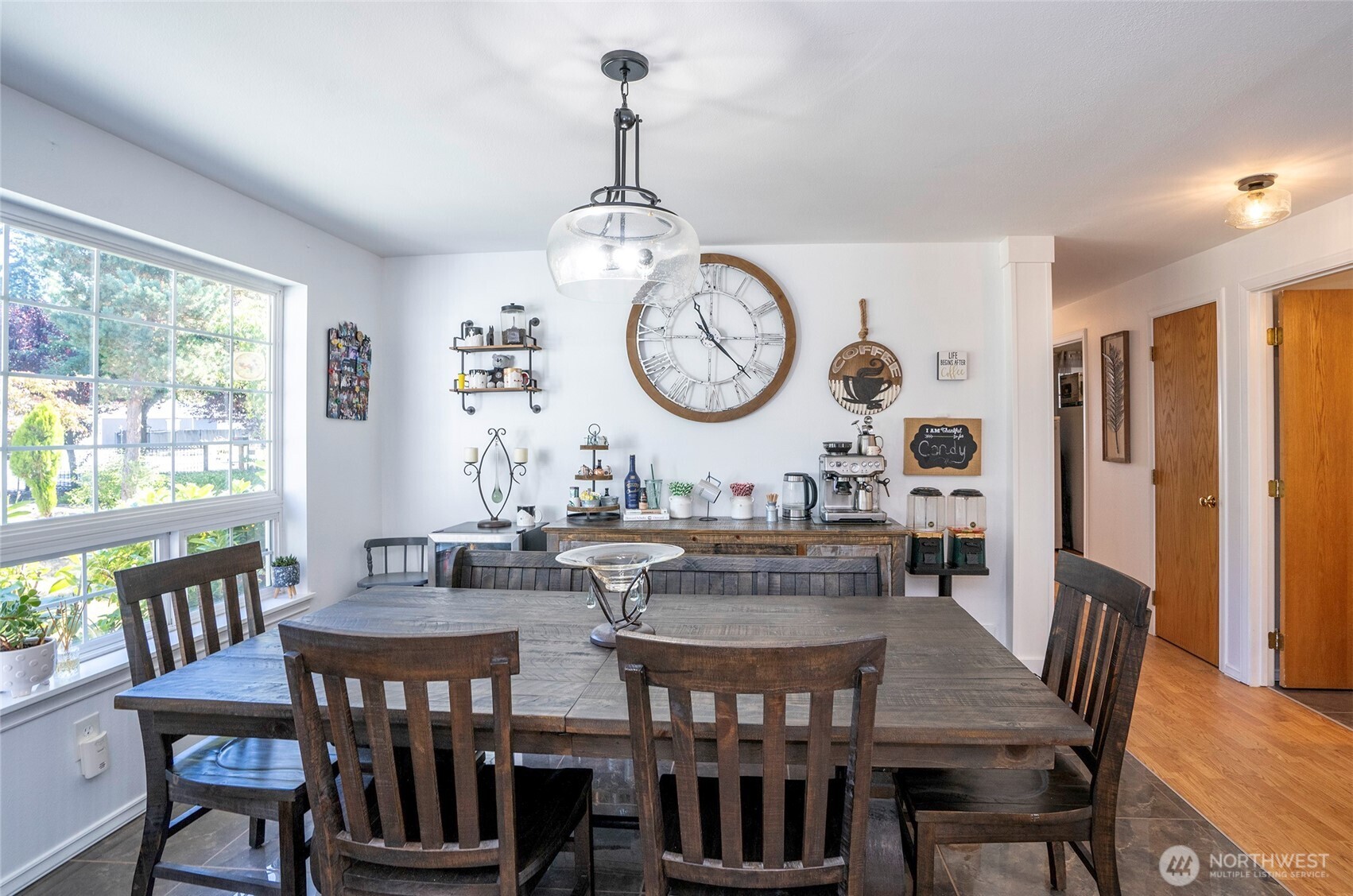 4712 Brookdale Road East Tacoma, WA 98446 - Photo 18 of 40 a view of a dining room with furniture window and wooden floor
