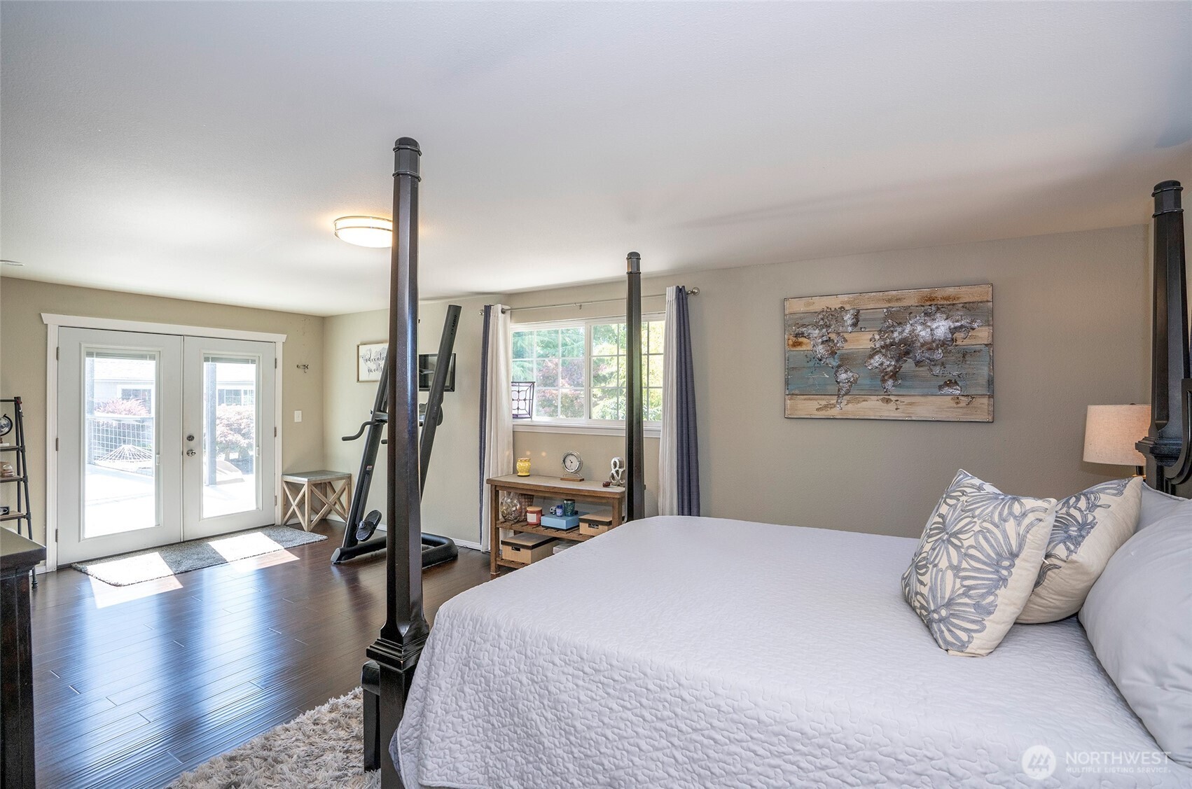 4712 Brookdale Road East Tacoma, WA 98446 - Photo 21 of 40 a bedroom with a large bed and a large window