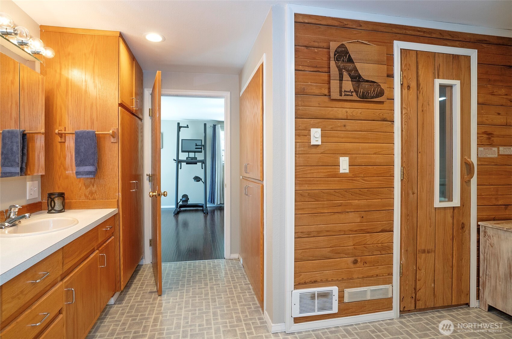 4712 Brookdale Road East Tacoma, WA 98446 - Photo 22 of 40 a bathroom with a sink a mirror and a shower