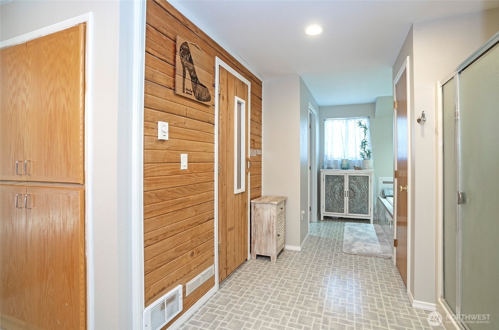 4712 Brookdale Road East Tacoma, WA 98446 - Photo 23 of 40 a view of a hallway with a door and couch
