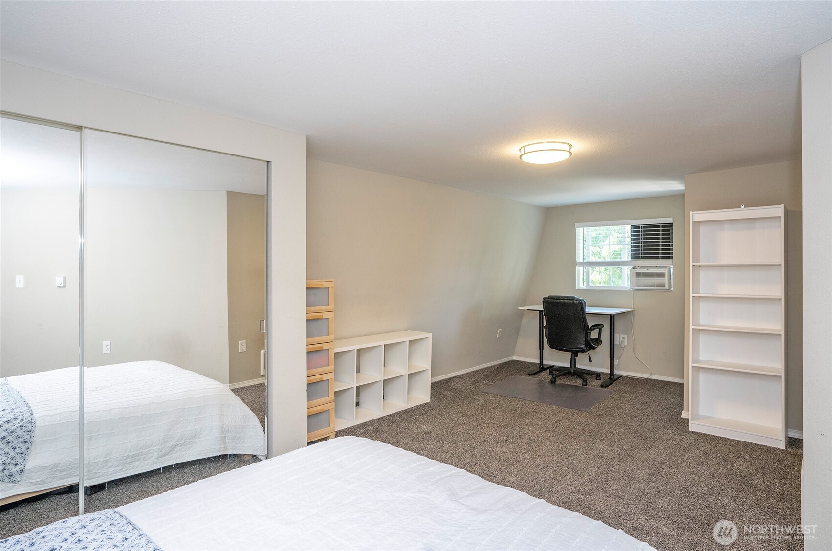 4712 Brookdale Road East Tacoma, WA 98446 - Photo 27 of 40 a bedroom with a bed and a desk in it