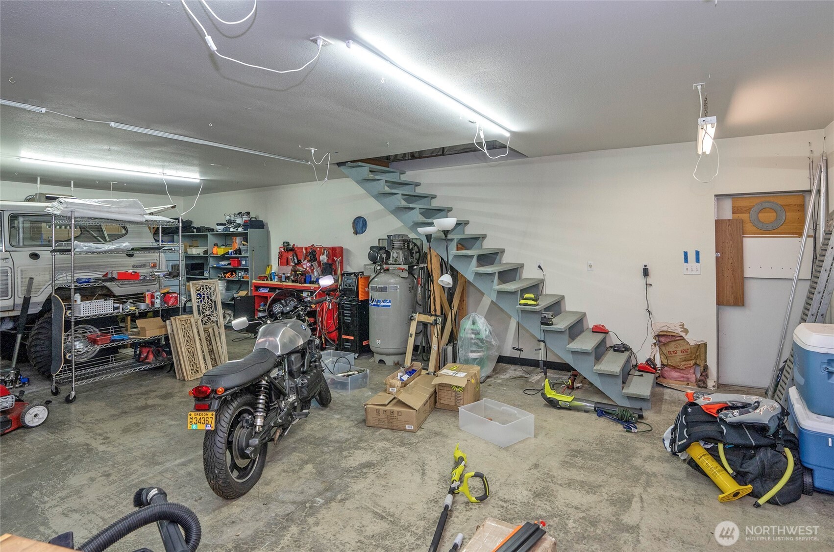 4712 Brookdale Road East Tacoma, WA 98446 - Photo 35 of 40 a view of a storage with a bike and car