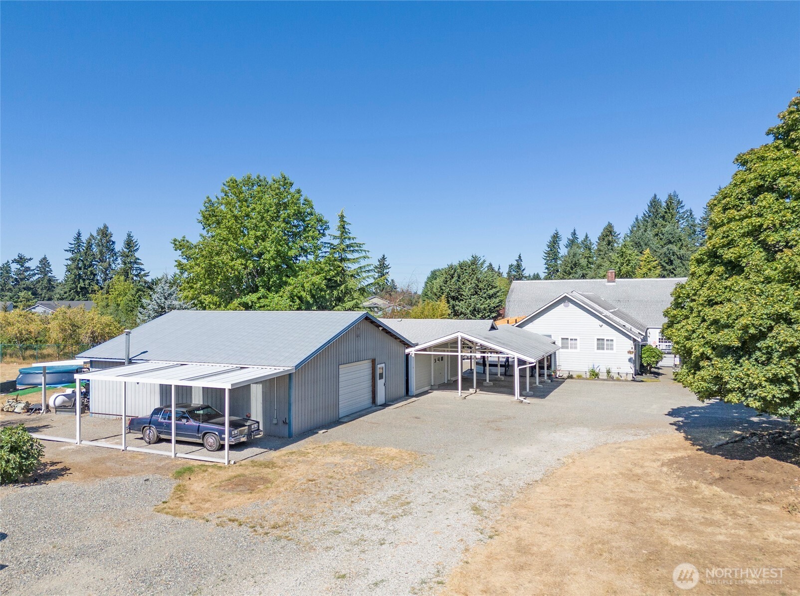 4712 Brookdale Road East Tacoma, WA 98446 - Photo 36 of 40 a view of a house with a yard and balcony