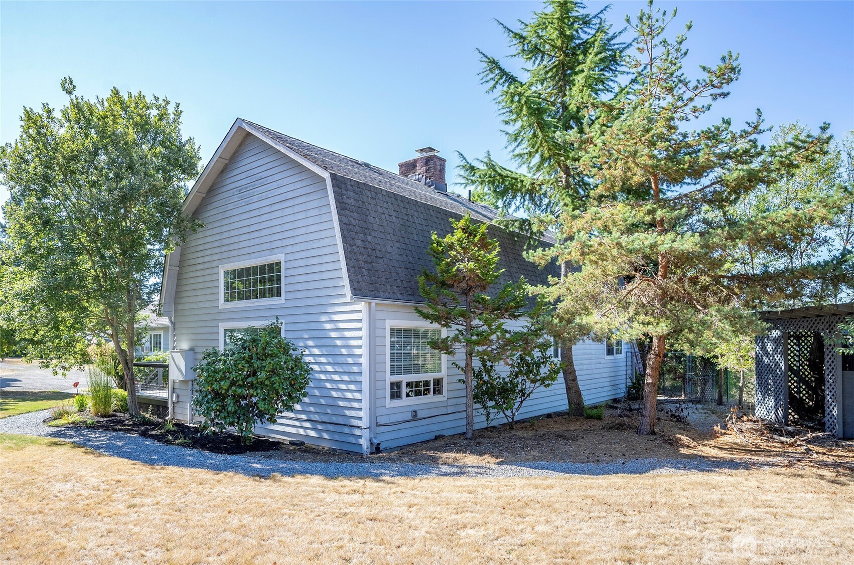 4712 Brookdale Road East Tacoma, WA 98446 - Photo 5 of 40 a view of a house with a tree in the background