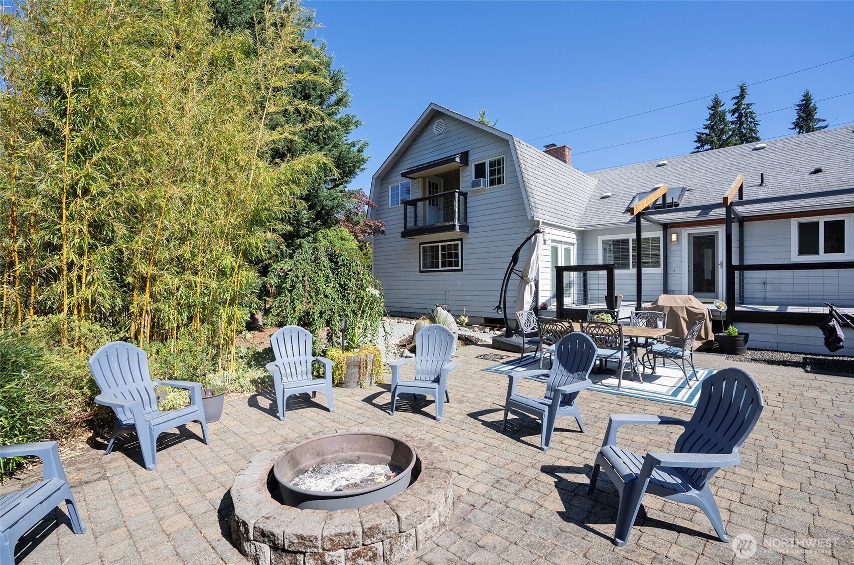 4712 Brookdale Road East Tacoma, WA 98446 - Photo 8 of 40 a backyard of a house with fire pit and outdoor seating