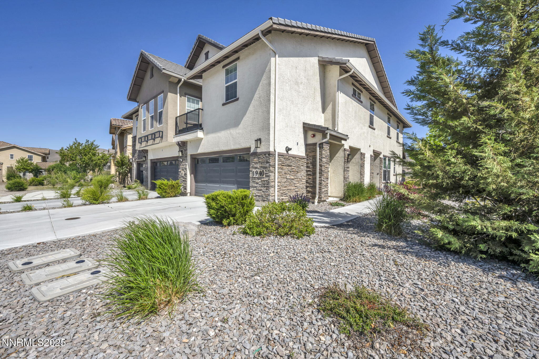 1940 Dark Horse Road, Unit C Reno, NV 89521 - Photo 1 of 69 a front view of a house with a yard