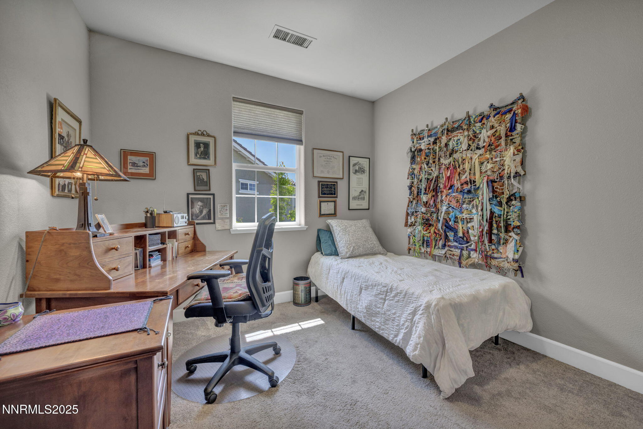 1940 Dark Horse Road, Unit C Reno, NV 89521 - Photo 35 of 69 a bedroom with a bed and a desk