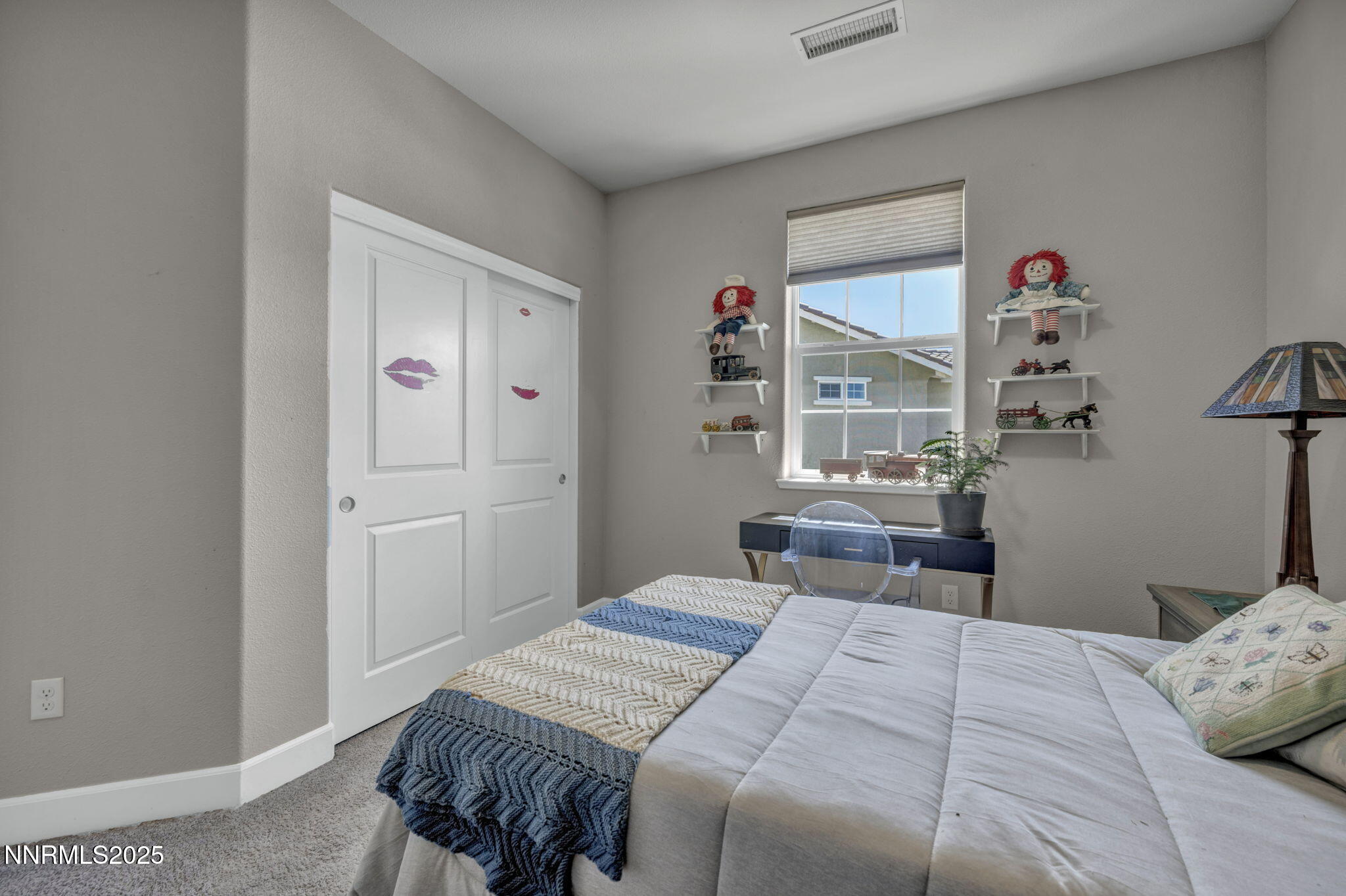1940 Dark Horse Road, Unit C Reno, NV 89521 - Photo 37 of 69 a bedroom with a bed and dresser with wooden floor