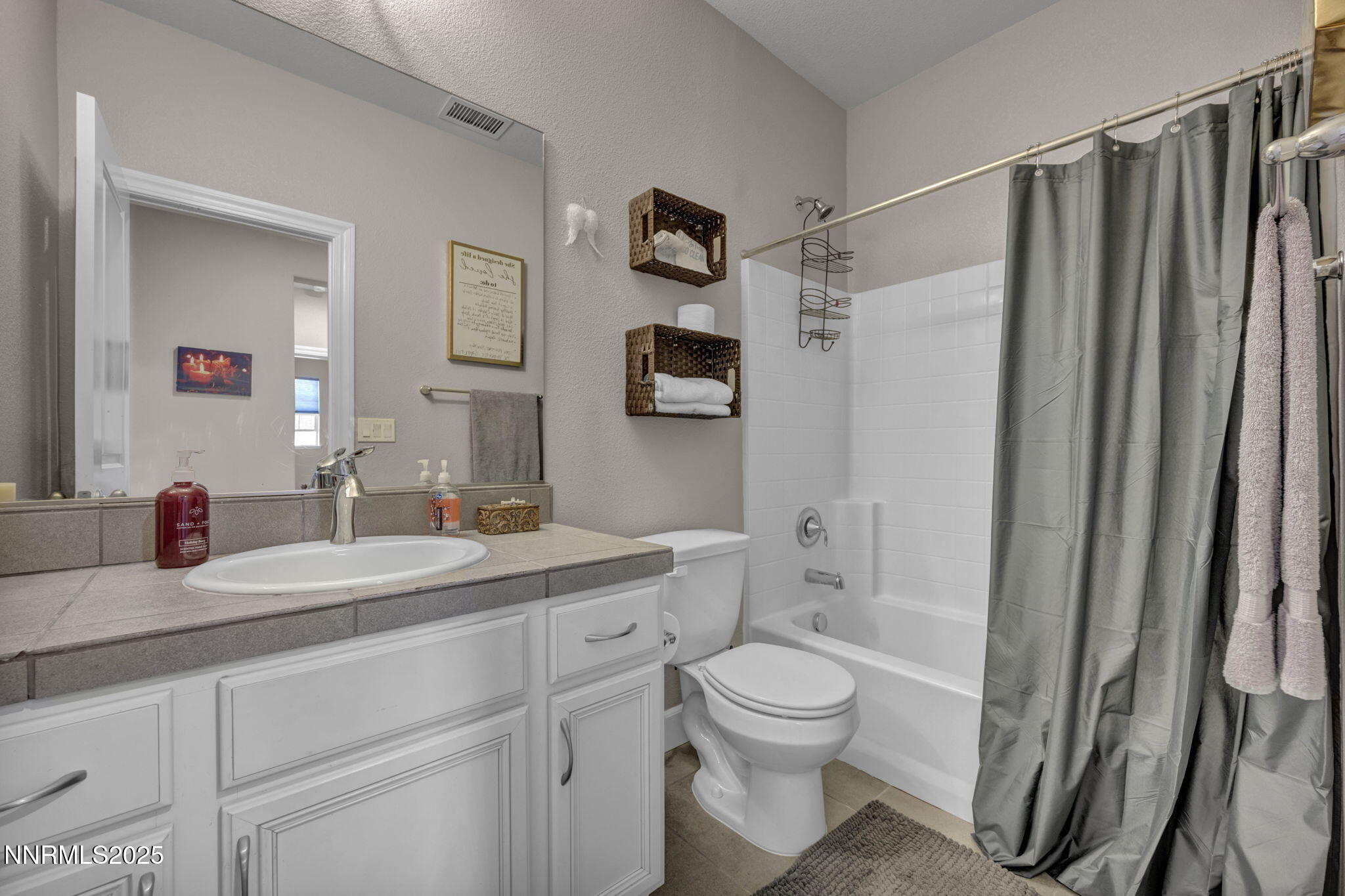 1940 Dark Horse Road, Unit C Reno, NV 89521 - Photo 40 of 69 a bathroom with a granite countertop sink toilet and shower