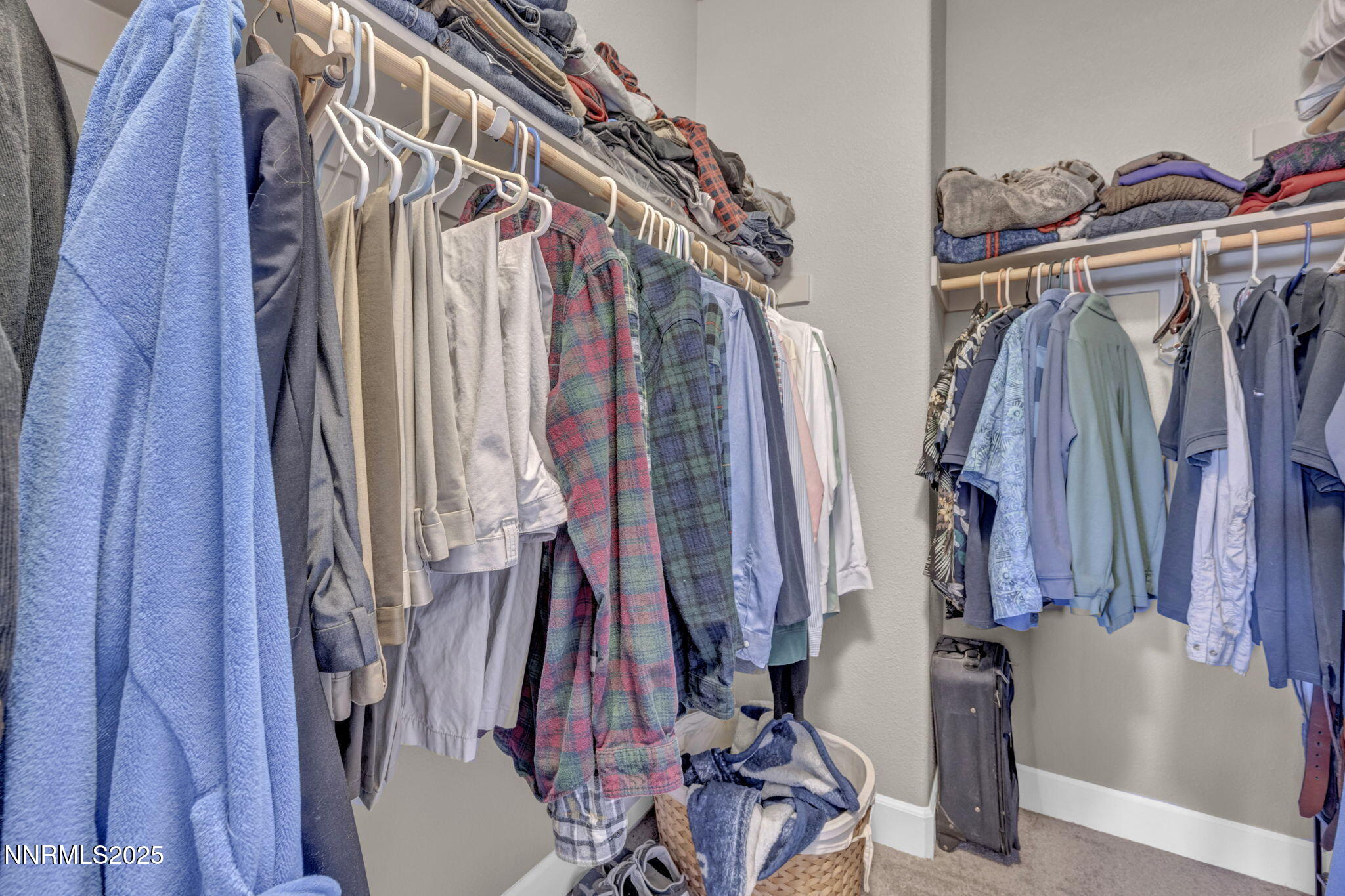 1940 Dark Horse Road, Unit C Reno, NV 89521 - Photo 44 of 69 a view of walk in closet with clothes