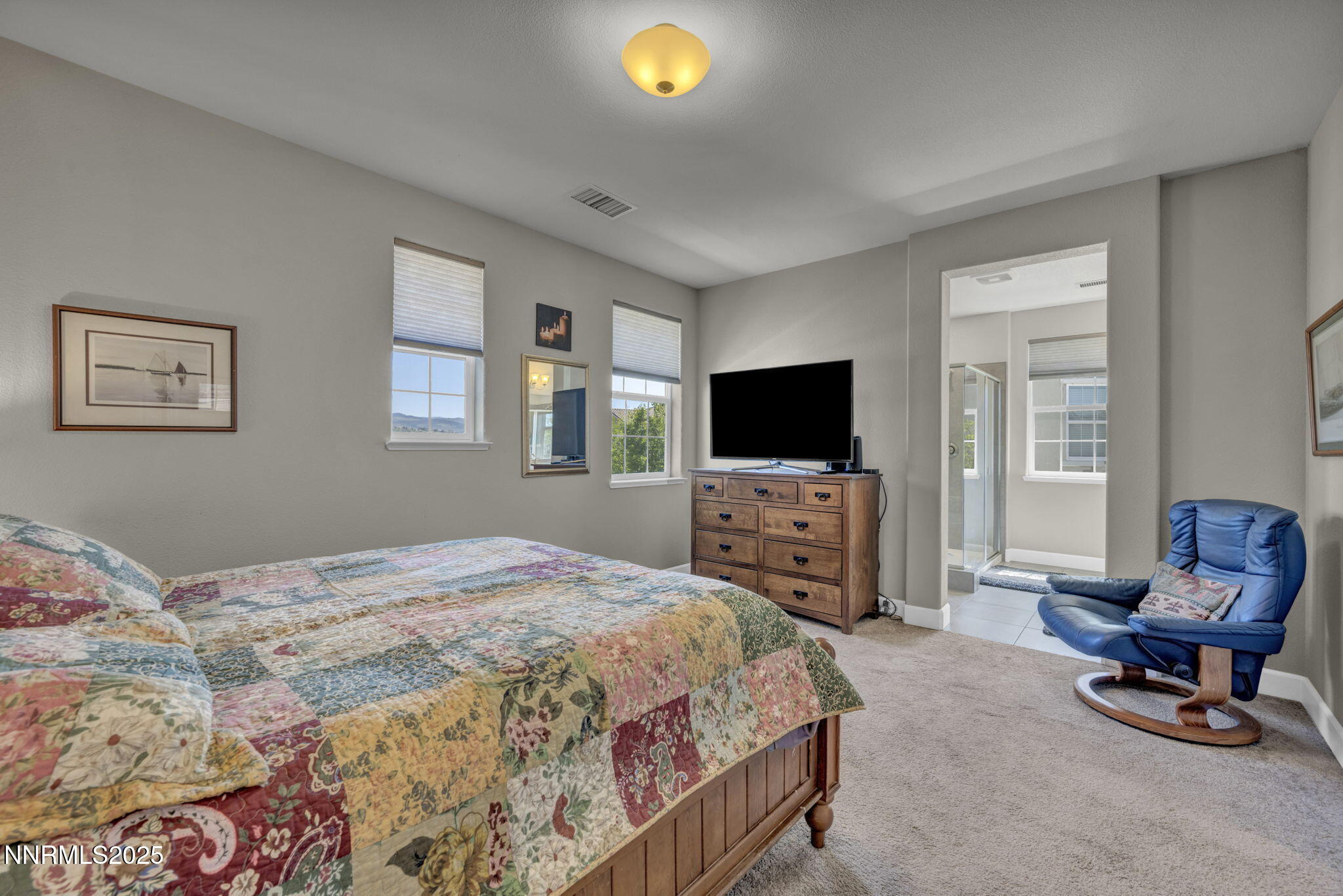 1940 Dark Horse Road, Unit C Reno, NV 89521 - Photo 45 of 69 a bedroom with a bed and a flat screen tv