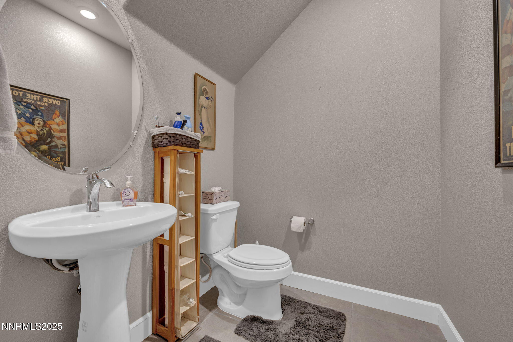 1940 Dark Horse Road, Unit C Reno, NV 89521 - Photo 66 of 69 a bathroom with a toilet a sink and mirror