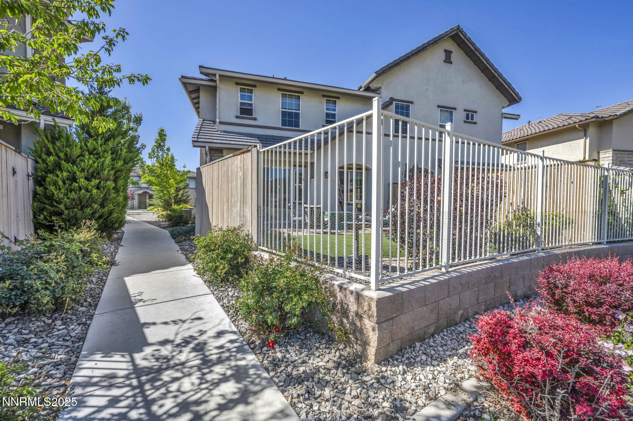 1940 Dark Horse Road, Unit C Reno, NV 89521 - Photo 8 of 69 a front view of a house with a garden