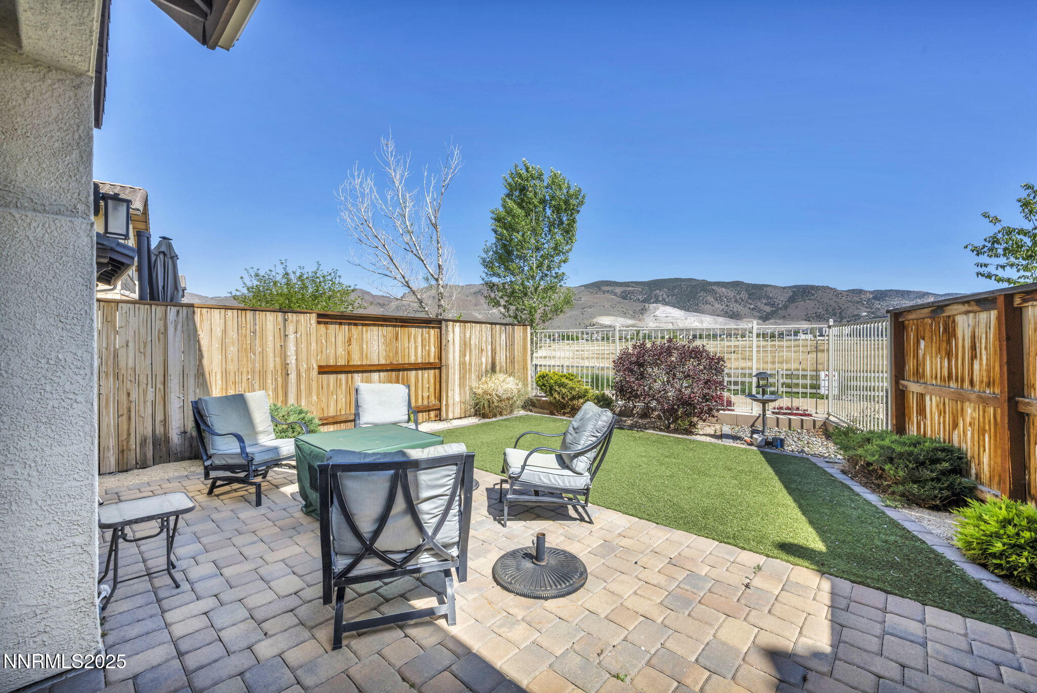 1940 Dark Horse Road, Unit C Reno, NV 89521 - Photo 9 of 69 a view of a patio with chairs potted plants with wooden floor