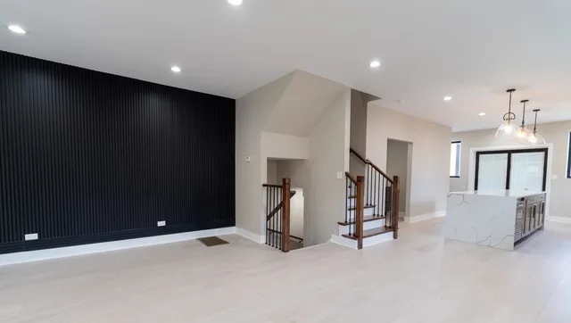 a living room with a fireplace and a large window