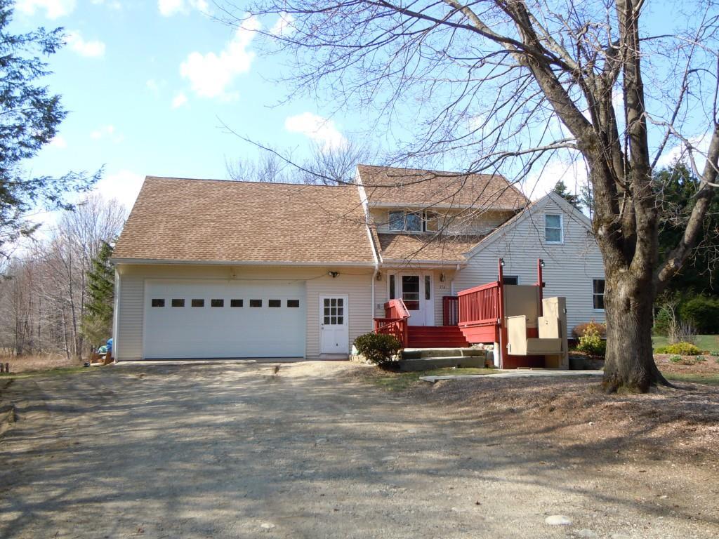 574 Hickory Hill Road Thomaston, CT 06787 - Photo 1 of 1 a front view of a house with large trees