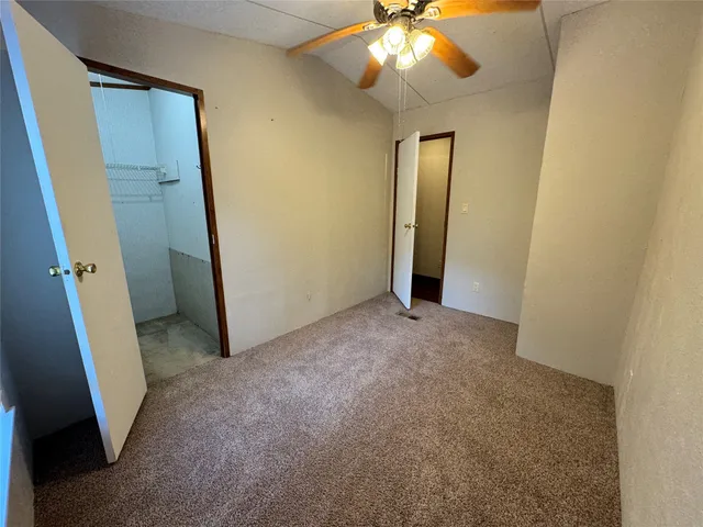 an empty room with a bathroom