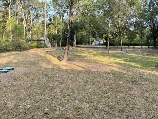 a view of a playground with basketball court