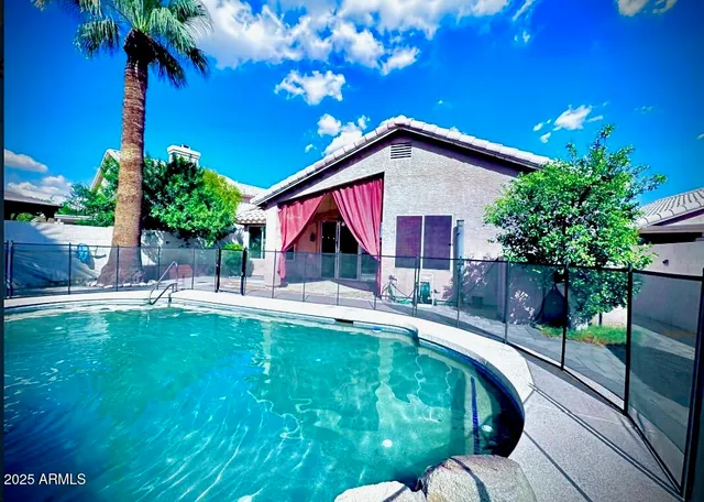 a view of swimming pool with a patio