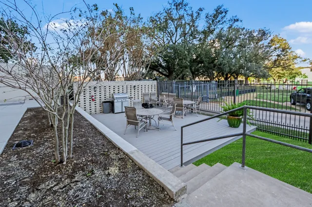 a view of a park with large trees