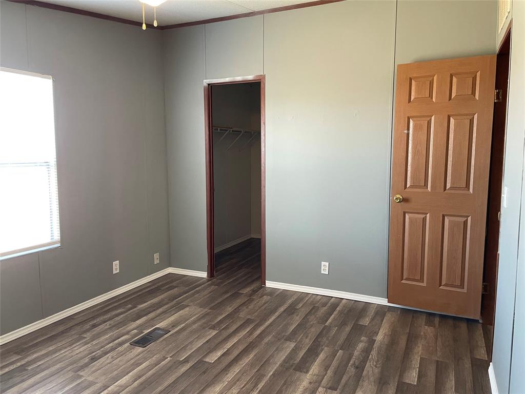 9624 Clark Street Joshua, TX 76058 - Photo 21 of 22 an empty room with wooden floor and windows