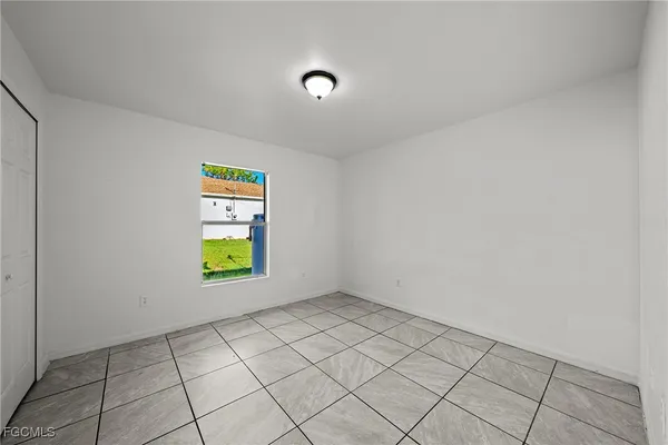 a view of an empty room and window