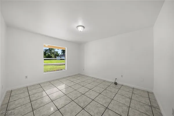 a view of an empty room and window