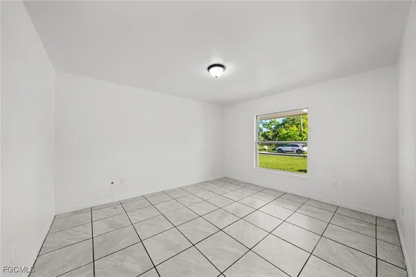 a view of an empty room and window