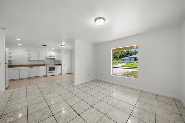 a view of an empty room and window
