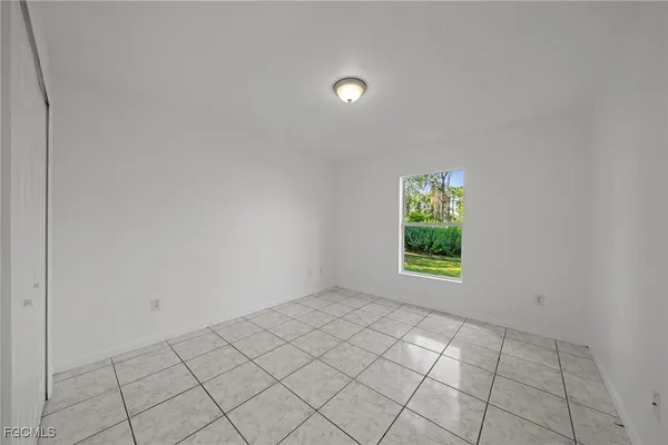 a view of an empty room and window