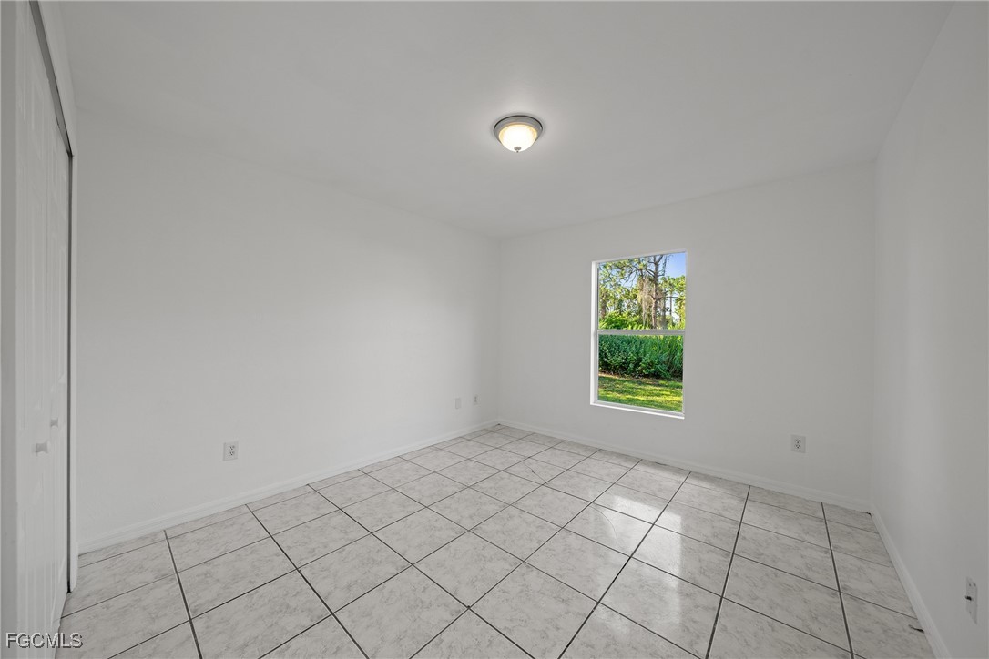 4735 30th Street Southwest Lehigh Acres, FL 33973 - Photo 27 of 43 a view of an empty room and window