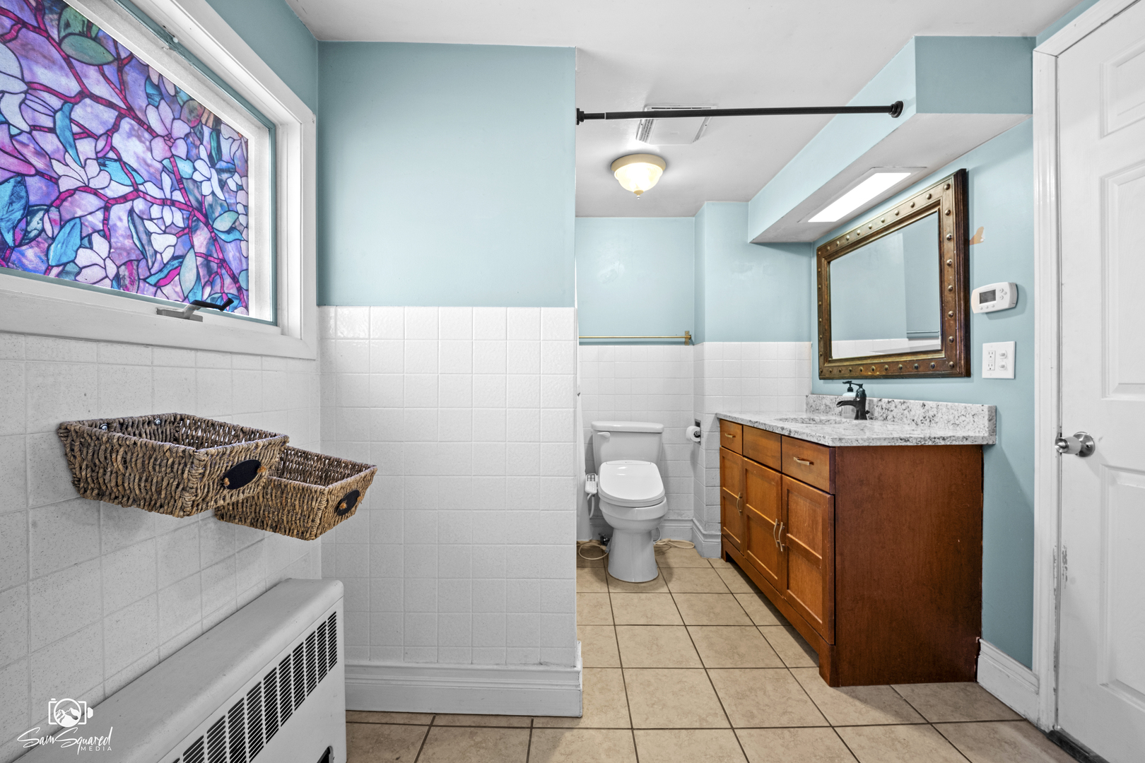 10947 1st Street Mokena, IL 60448 - Photo 23 of 29 a bathroom with a sink a vanity and a mirror