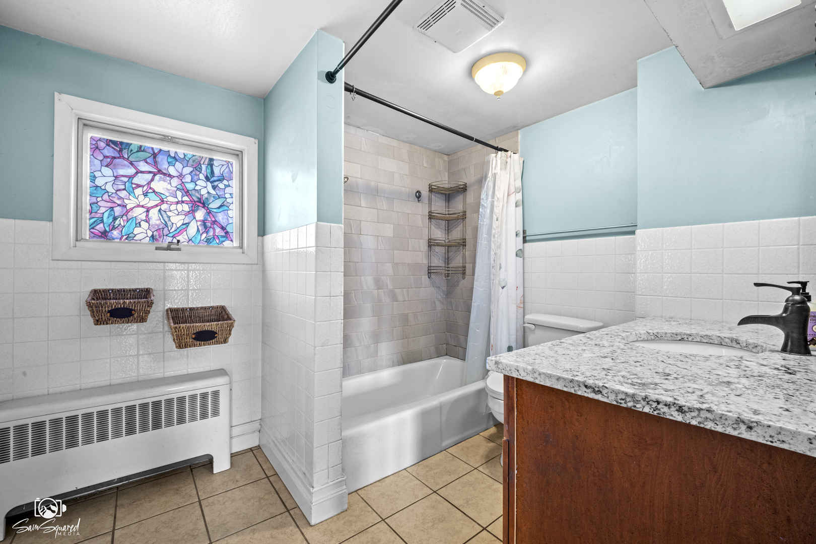 10947 1st Street Mokena, IL 60448 - Photo 24 of 29 a bathroom with a granite countertop sink a mirror a bathtub and shower