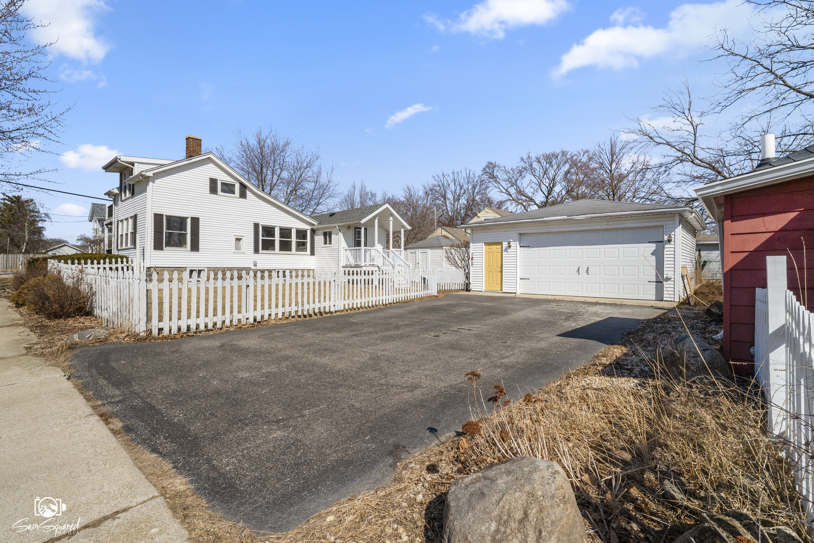 10947 1st Street Mokena, IL 60448 - Photo 5 of 29 a view of a white house with a yard and garage