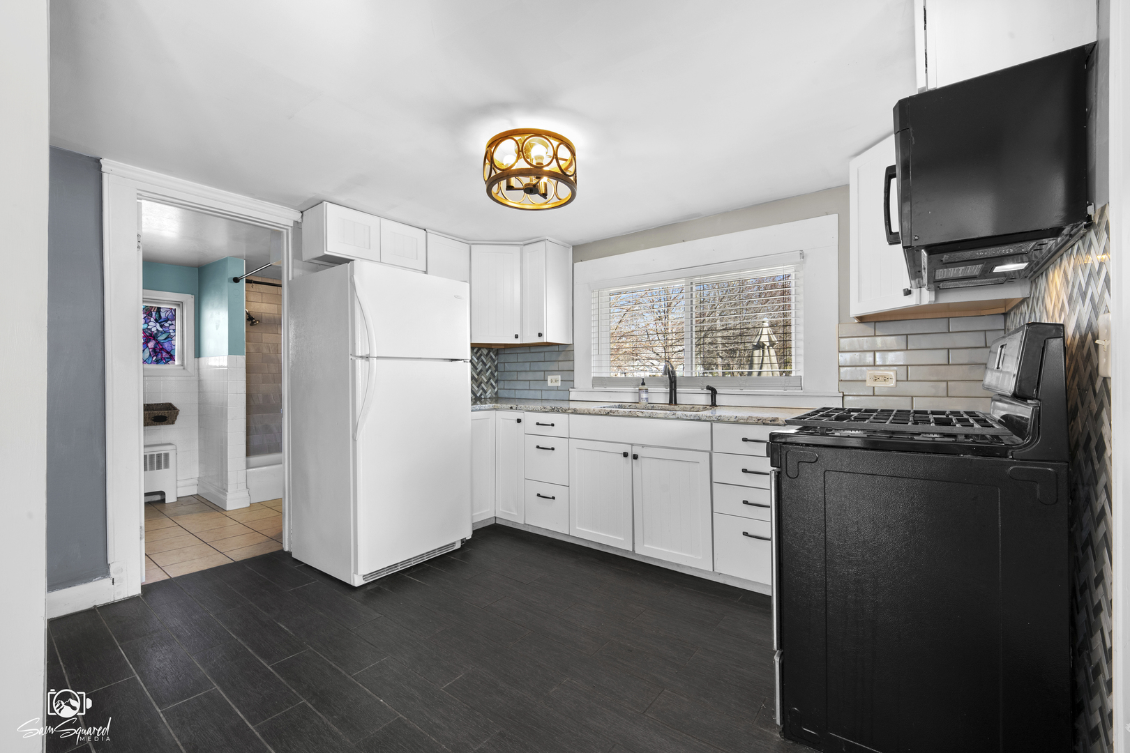 10947 1st Street Mokena, IL 60448 - Photo 8 of 29 a kitchen with a refrigerator and a stove top oven