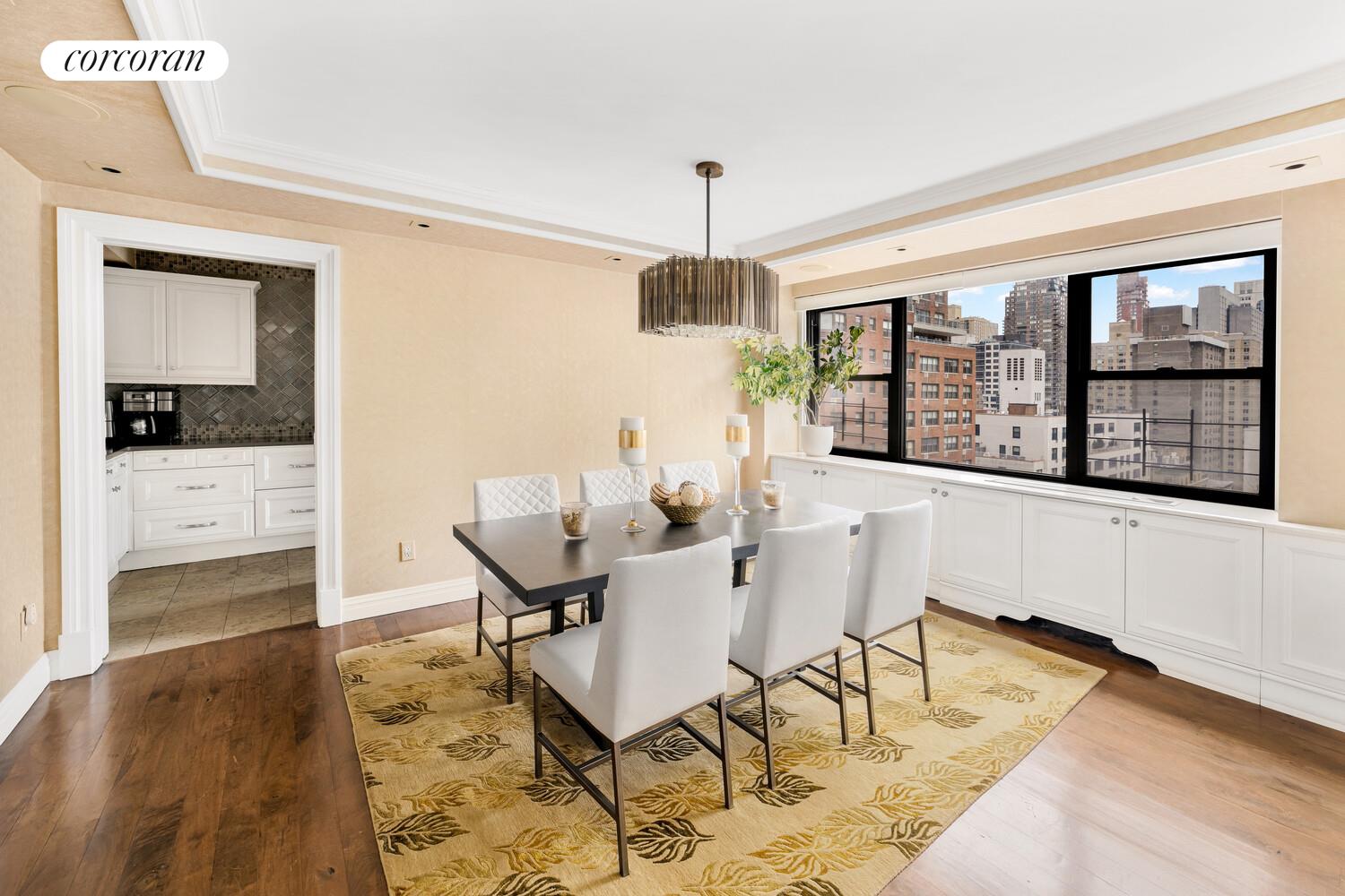233 East 69th Street, Unit 14K Manhattan, NY 10021 - Photo 3 of 12 a dining room with furniture and window